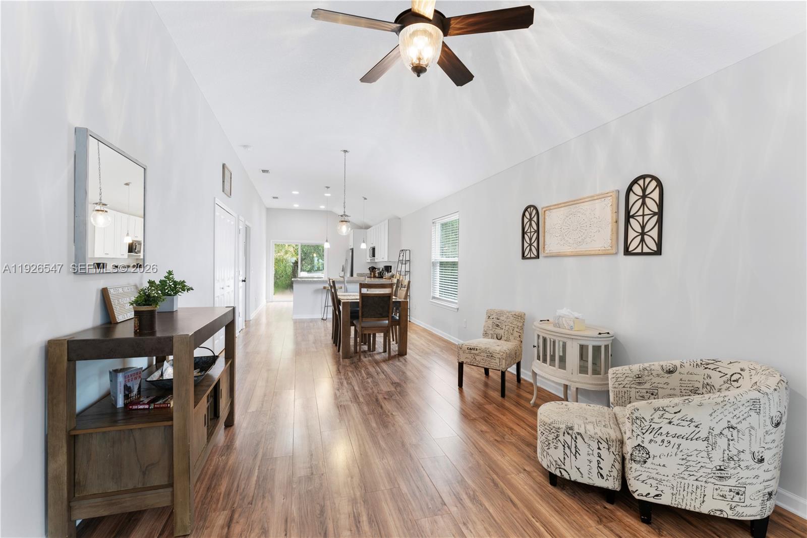 2 Poinciana Cove Road St. Augustine, FL 32084 - Photo 10 of 43 a living room with furniture and a wooden floor