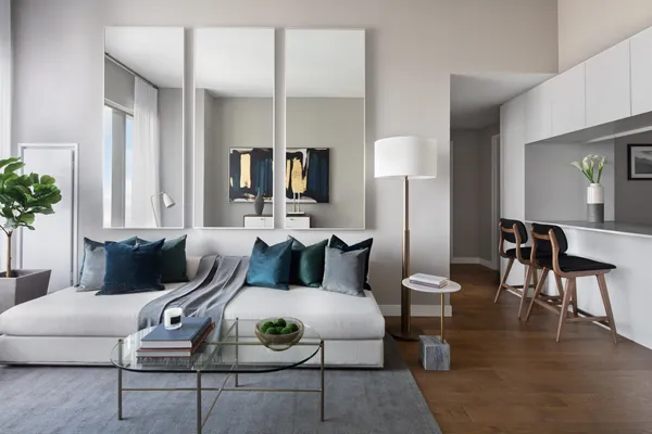 a living room with furniture and a potted plant