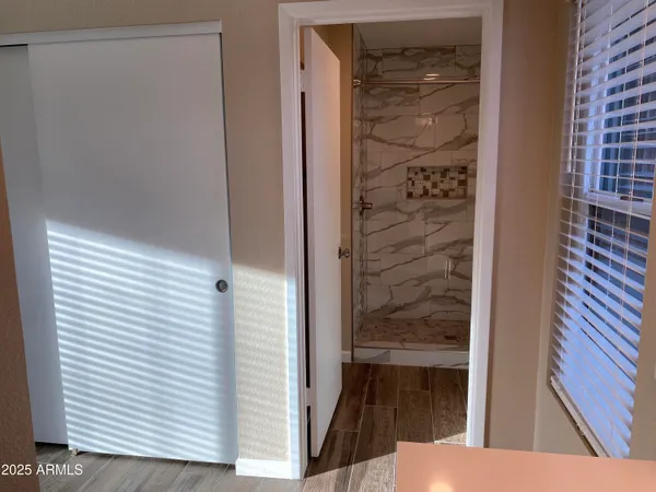 a bathroom with a double vanity sink and a mirror