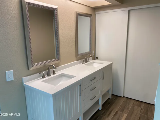 a view of a room with wooden floor