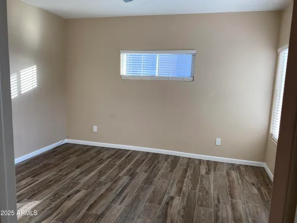 a bathroom with a granite countertop sink a toilet and a bathtub