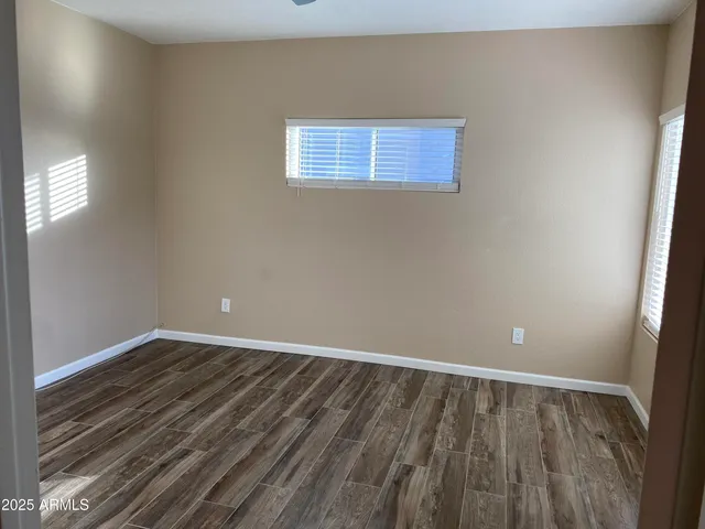 a bathroom with a granite countertop sink a toilet and a bathtub