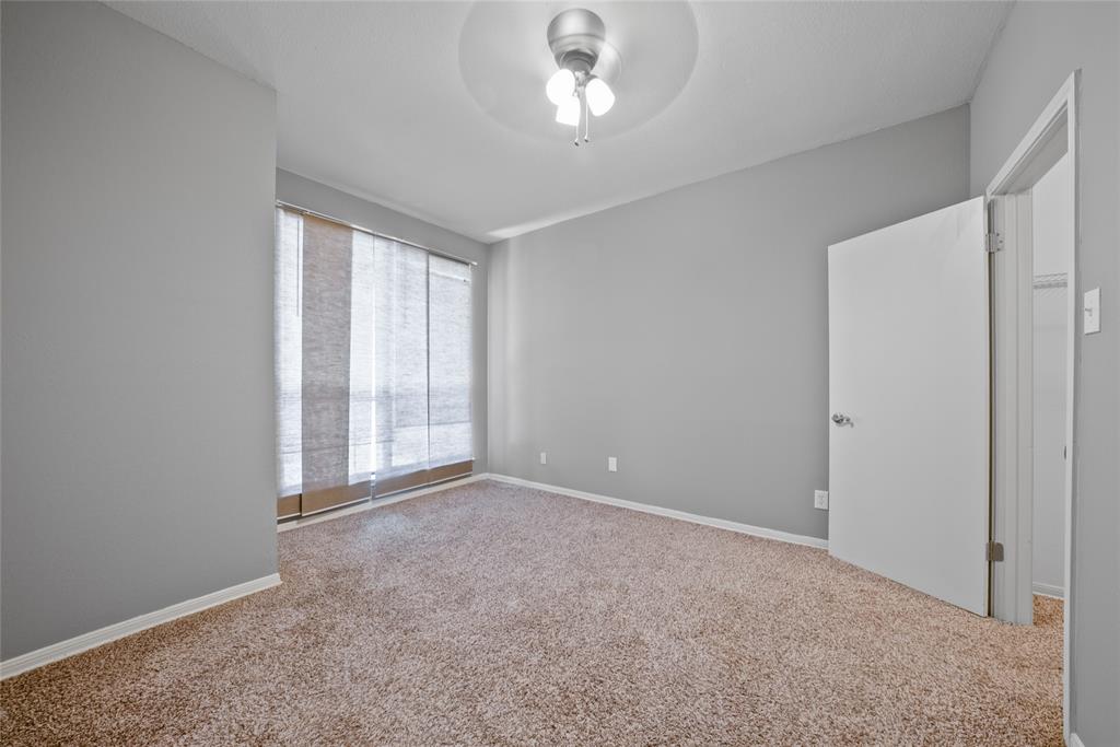8545 Midpark Road, Unit 47 Dallas, TX 75240 - Photo 7 of 10 a view of an empty room with a window