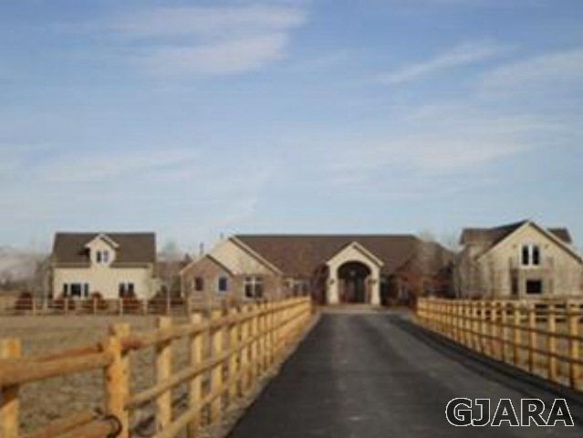 1158 19 Road Fruita, CO 81521 - Photo 1 of 1 a front view of a house with parking