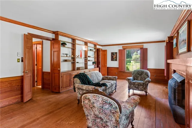 a living room with furniture fireplace and flat screen tv