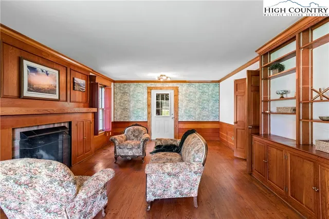 a bedroom with furniture and a fireplace