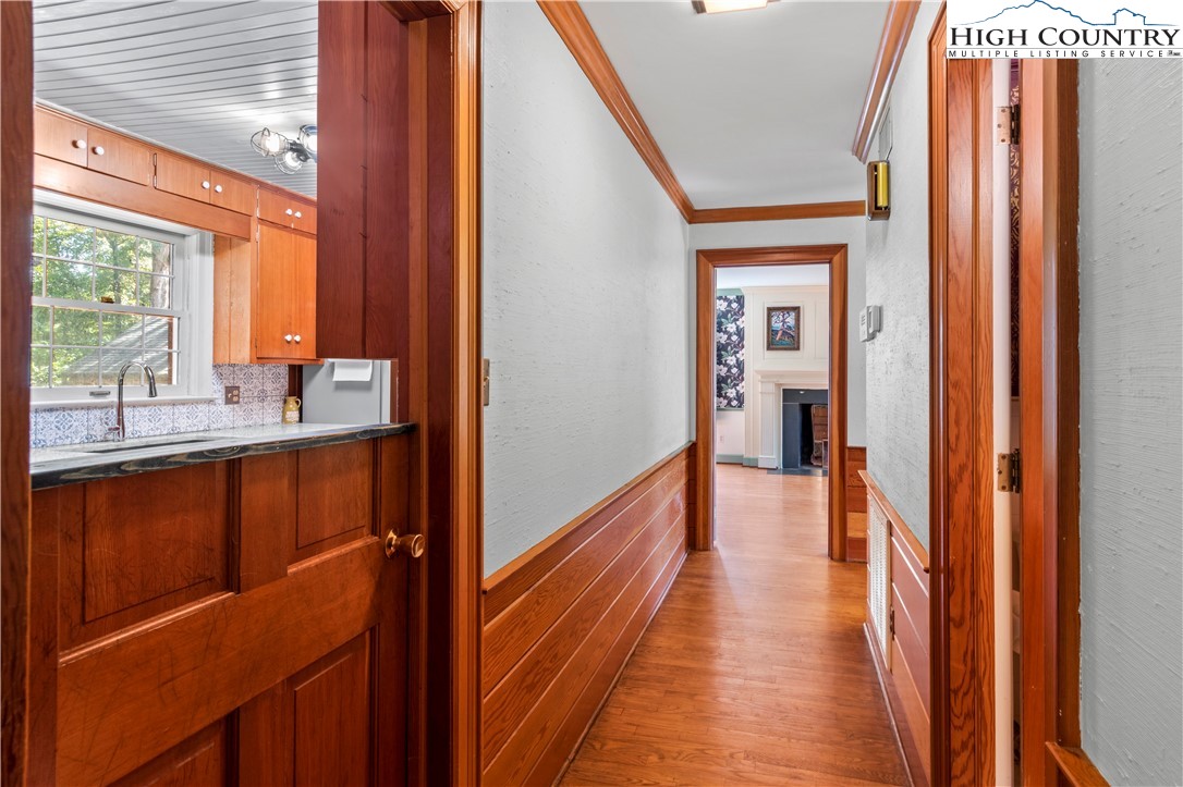205 Hawthorne Road Elkin, NC 28621 - Photo 20 of 38 a view of a hallway with wooden floor and windows