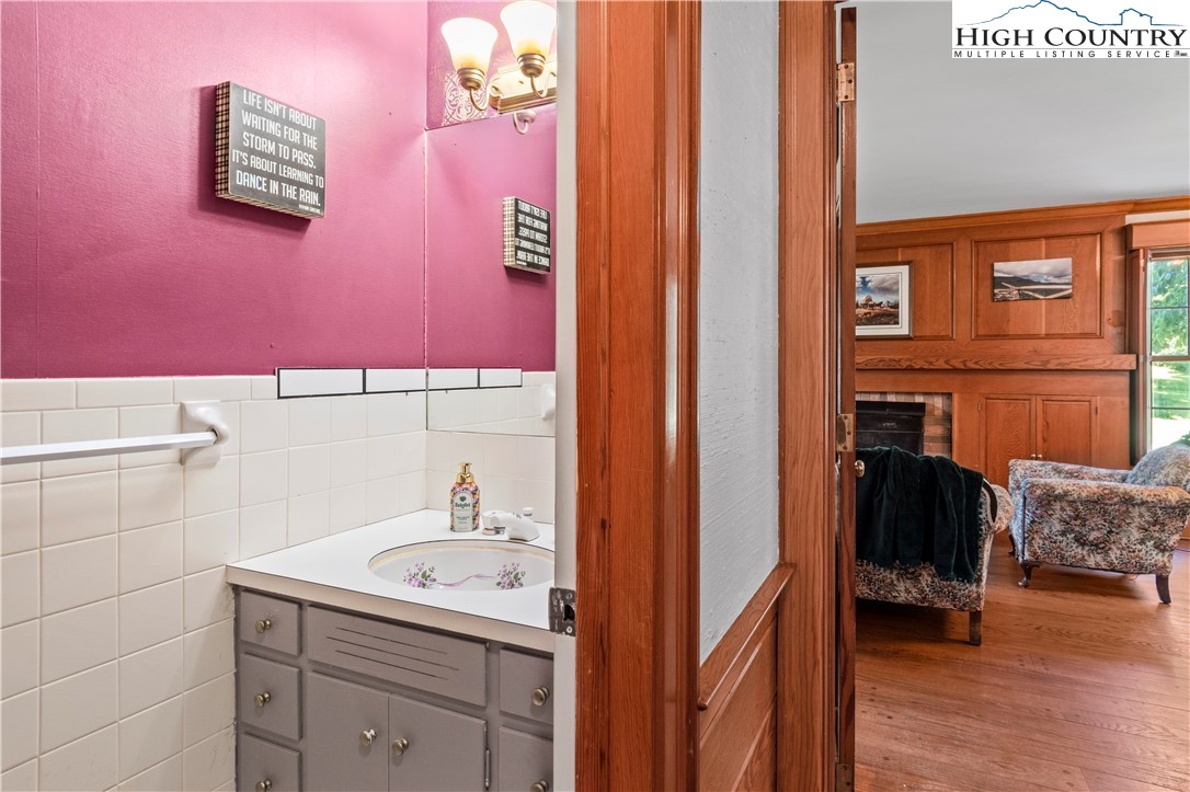 205 Hawthorne Road Elkin, NC 28621 - Photo 21 of 38 a bathroom with a sink and a mirror