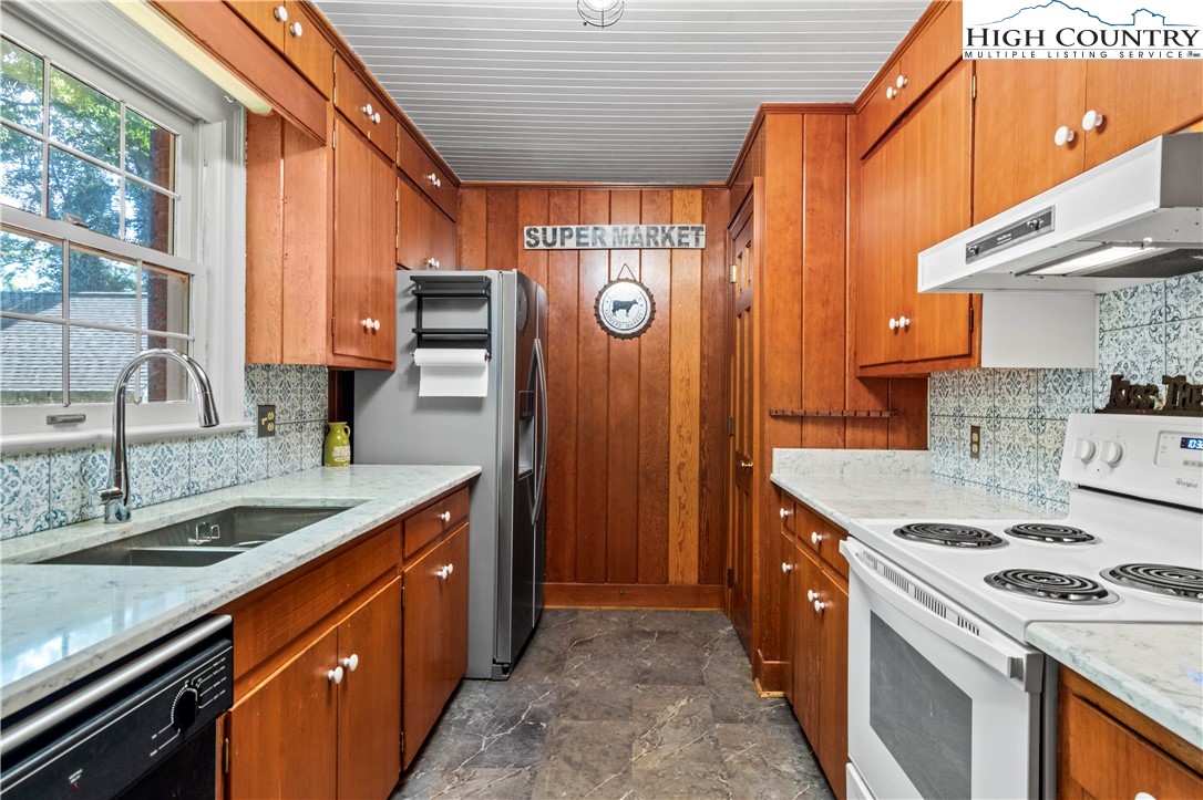 205 Hawthorne Road Elkin, NC 28621 - Photo 22 of 38 a kitchen that has a sink and a stove