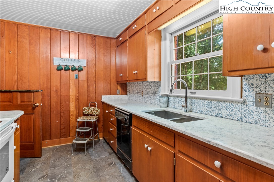 205 Hawthorne Road Elkin, NC 28621 - Photo 23 of 38 a bathroom with a sink and a window
