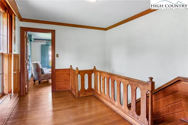 a view of a porch with wooden floor and windows