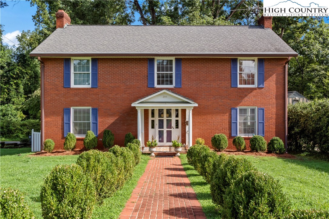 205 Hawthorne Road Elkin, NC 28621 - Photo 3 of 38 a front view of a house with a yard