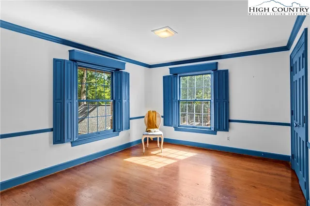 a living room with furniture and windows