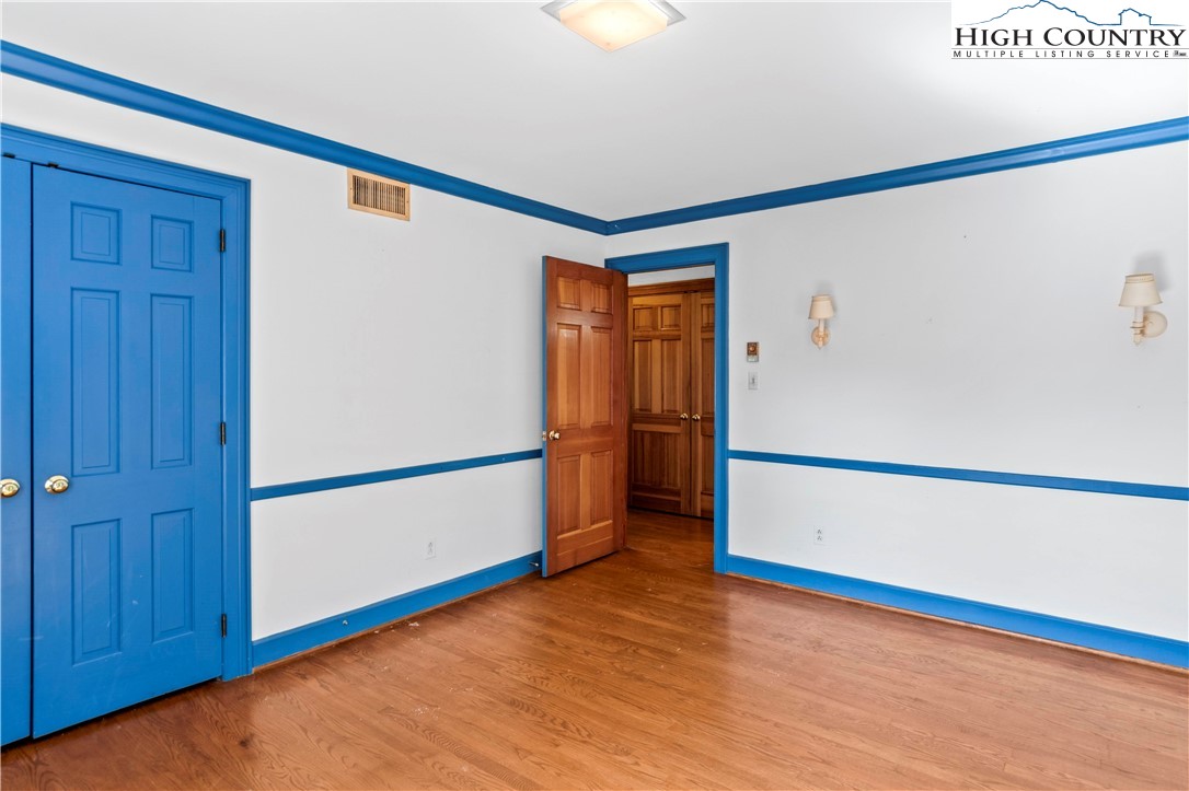 205 Hawthorne Road Elkin, NC 28621 - Photo 33 of 38 a view of empty room with wooden floor