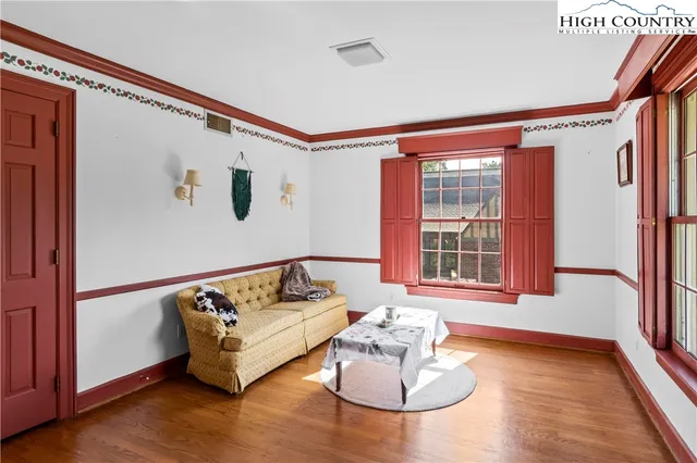 a bedroom with furniture and window