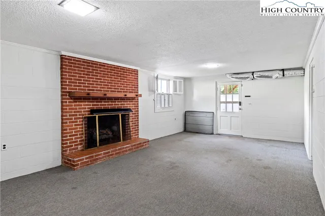 a view of a livingroom with a fireplace
