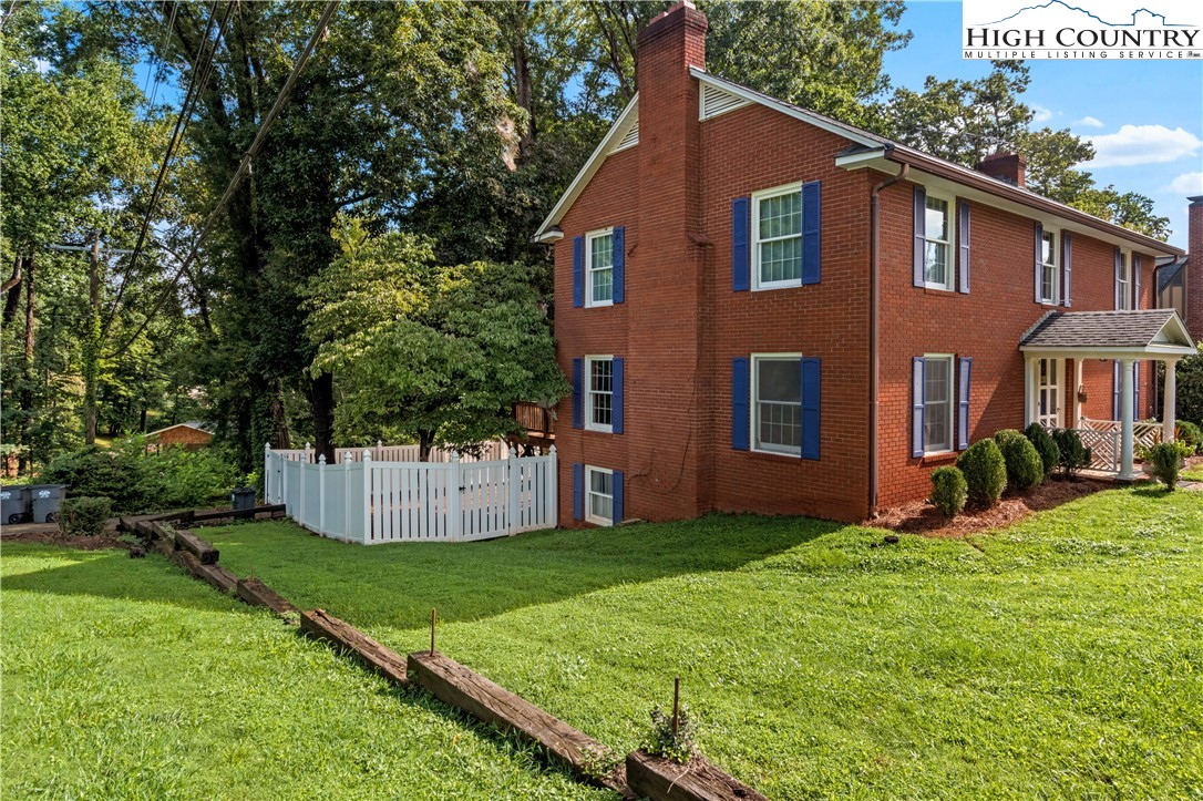 205 Hawthorne Road Elkin, NC 28621 - Photo 5 of 38 a front view of a house with a yard and tree