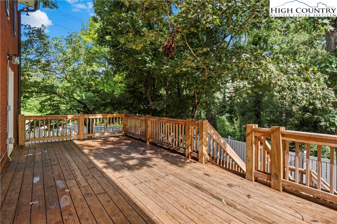 205 Hawthorne Road Elkin, NC 28621 - Photo 8 of 38 a view of deck with wooden floor and chair
