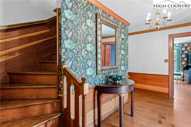 a front view of a house with a potted plant