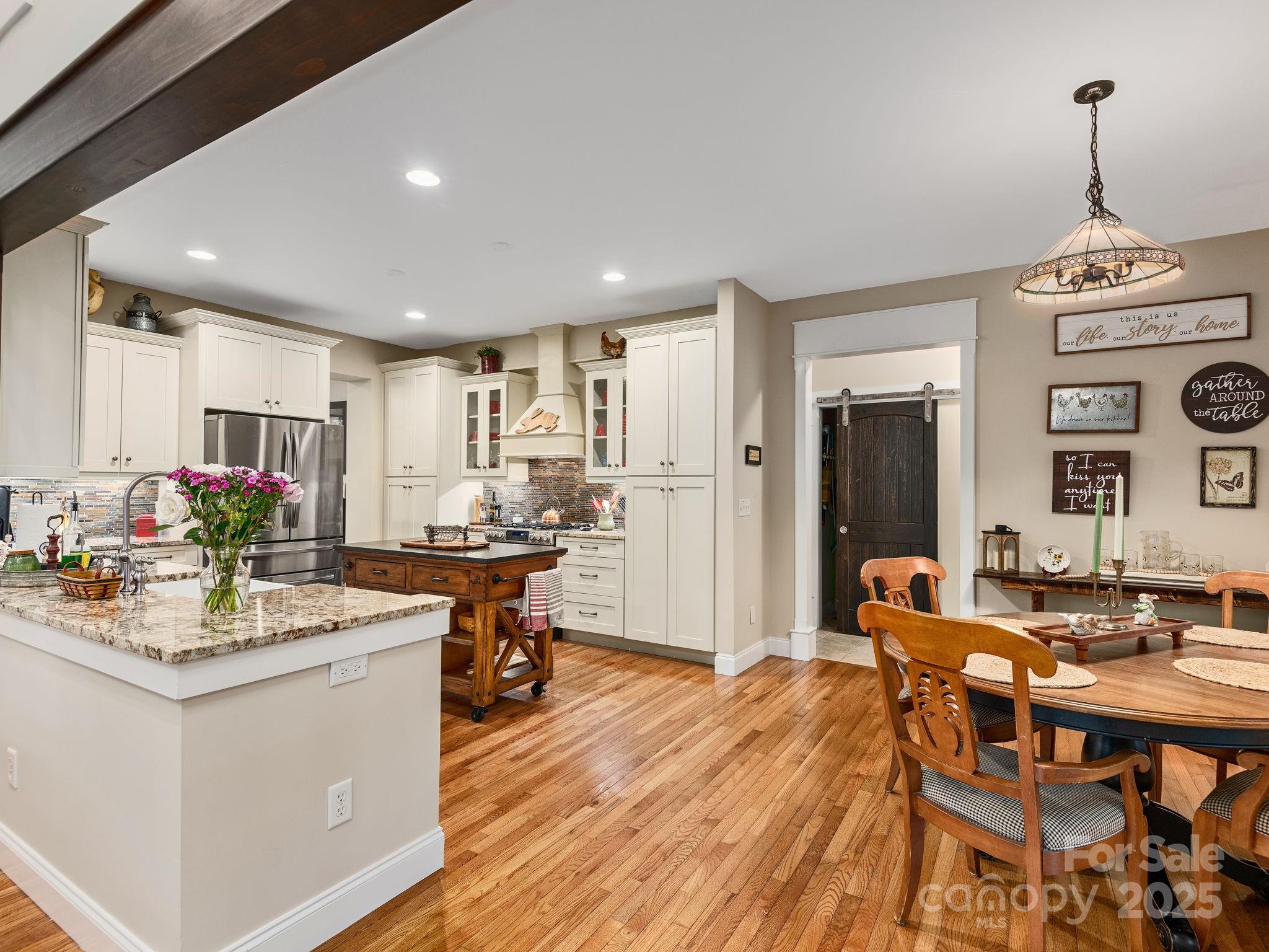 15 Avondale Road Asheville, NC 28803 - Photo 13 of 48 a view of a dining room with furniture and wooden floor