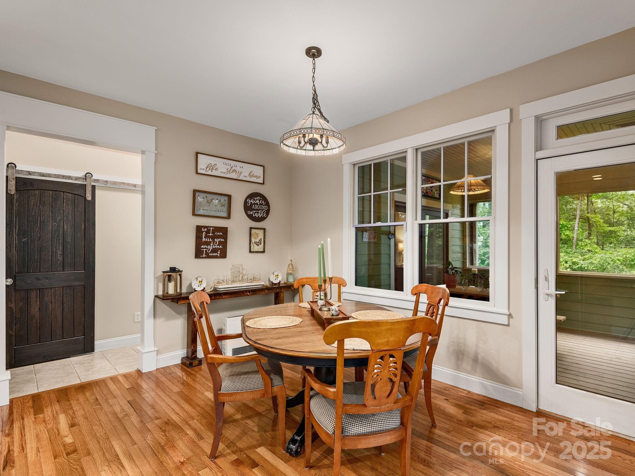 15 Avondale Road Asheville, NC 28803 - Photo 14 of 48 a dining room with furniture window and wooden floor