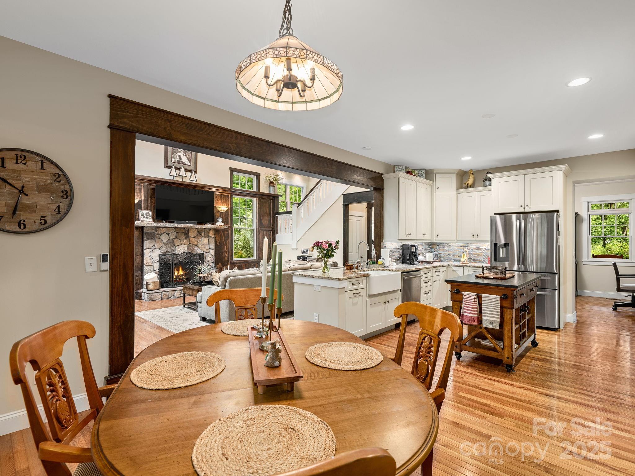 15 Avondale Road Asheville, NC 28803 - Photo 15 of 48 a dining room with furniture a large window and wooden floor