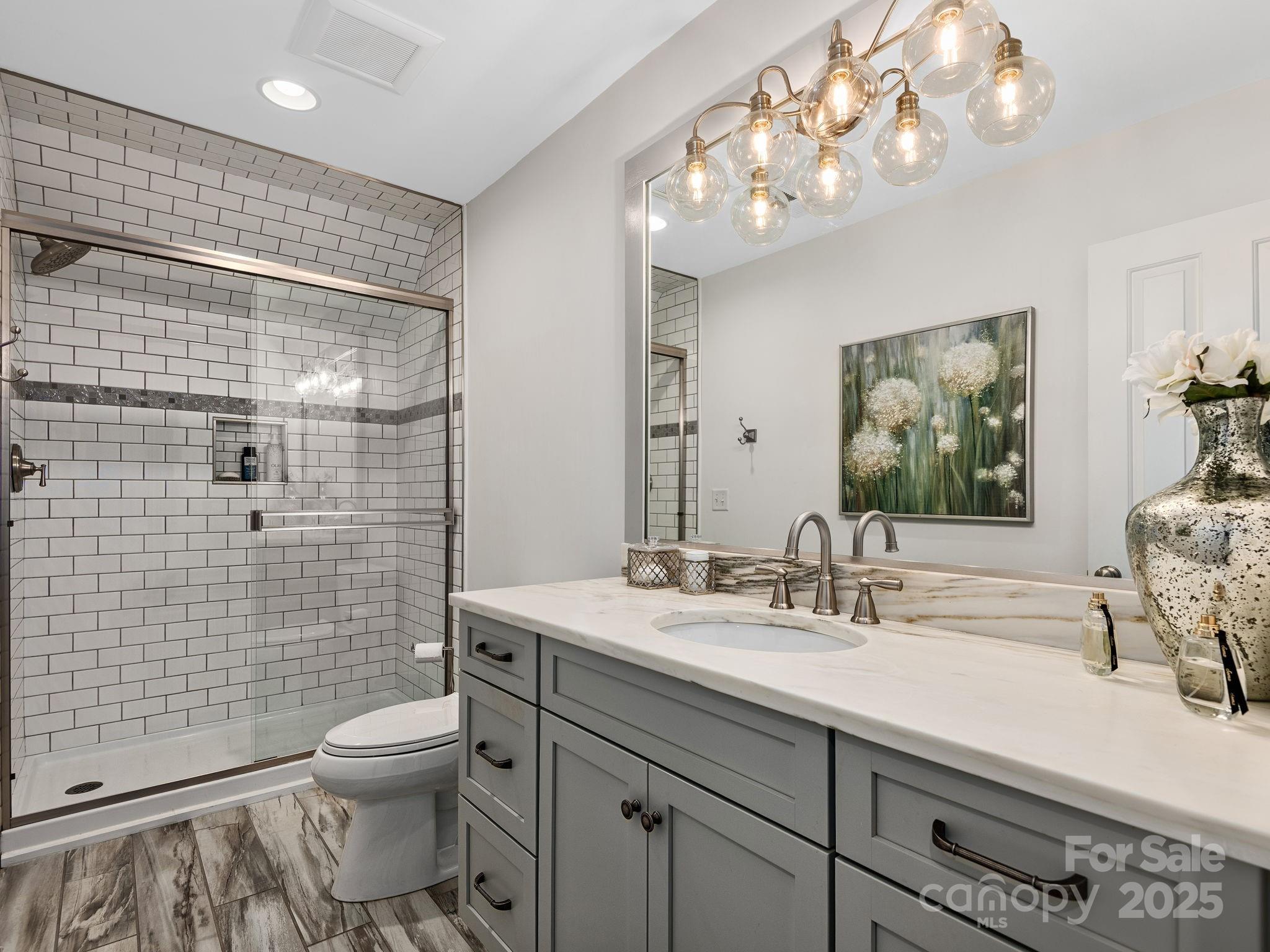 15 Avondale Road Asheville, NC 28803 - Photo 27 of 48 a bathroom with a sink a toilet and shower