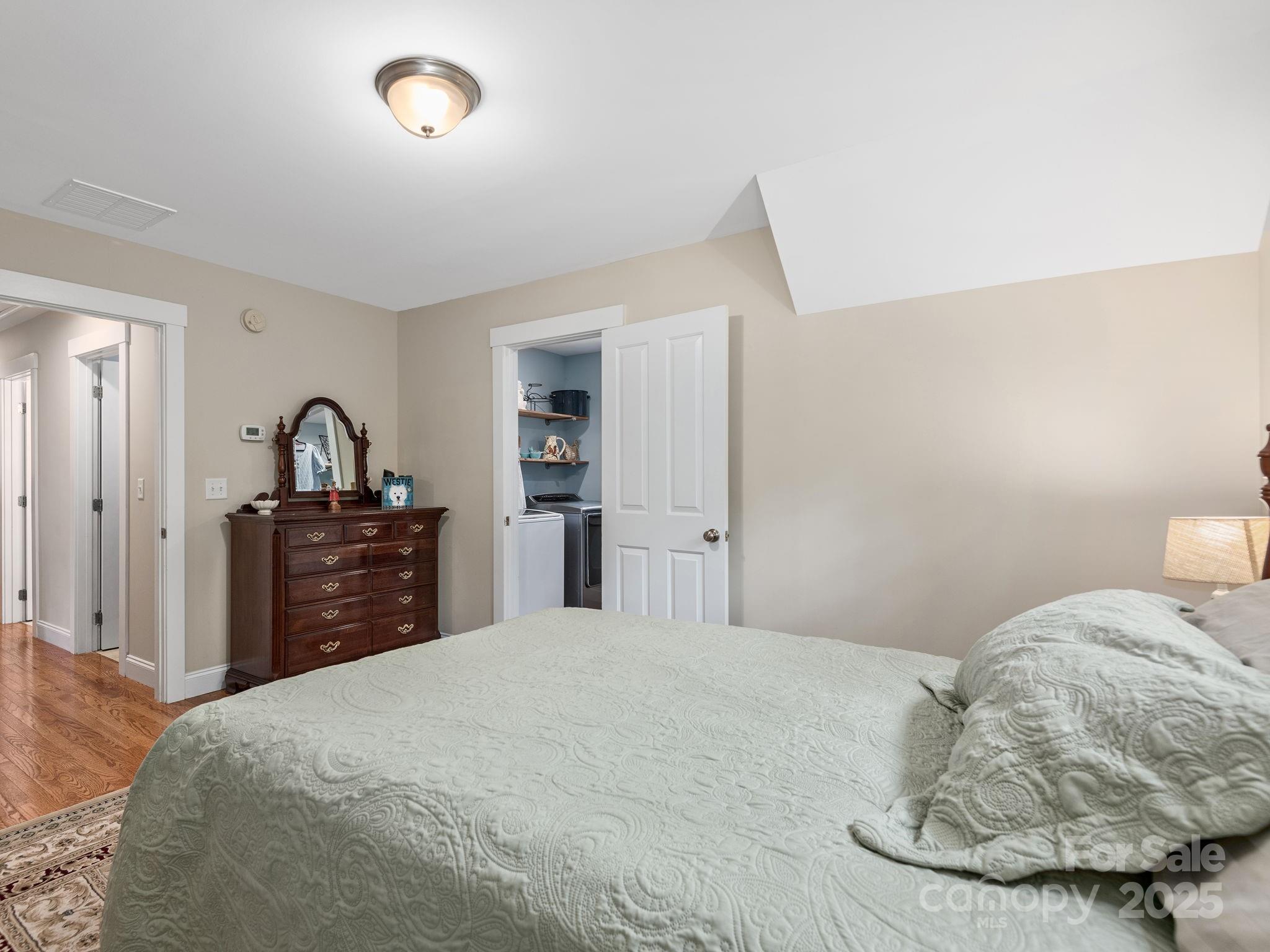15 Avondale Road Asheville, NC 28803 - Photo 33 of 48 a bedroom with a bed and a dresser