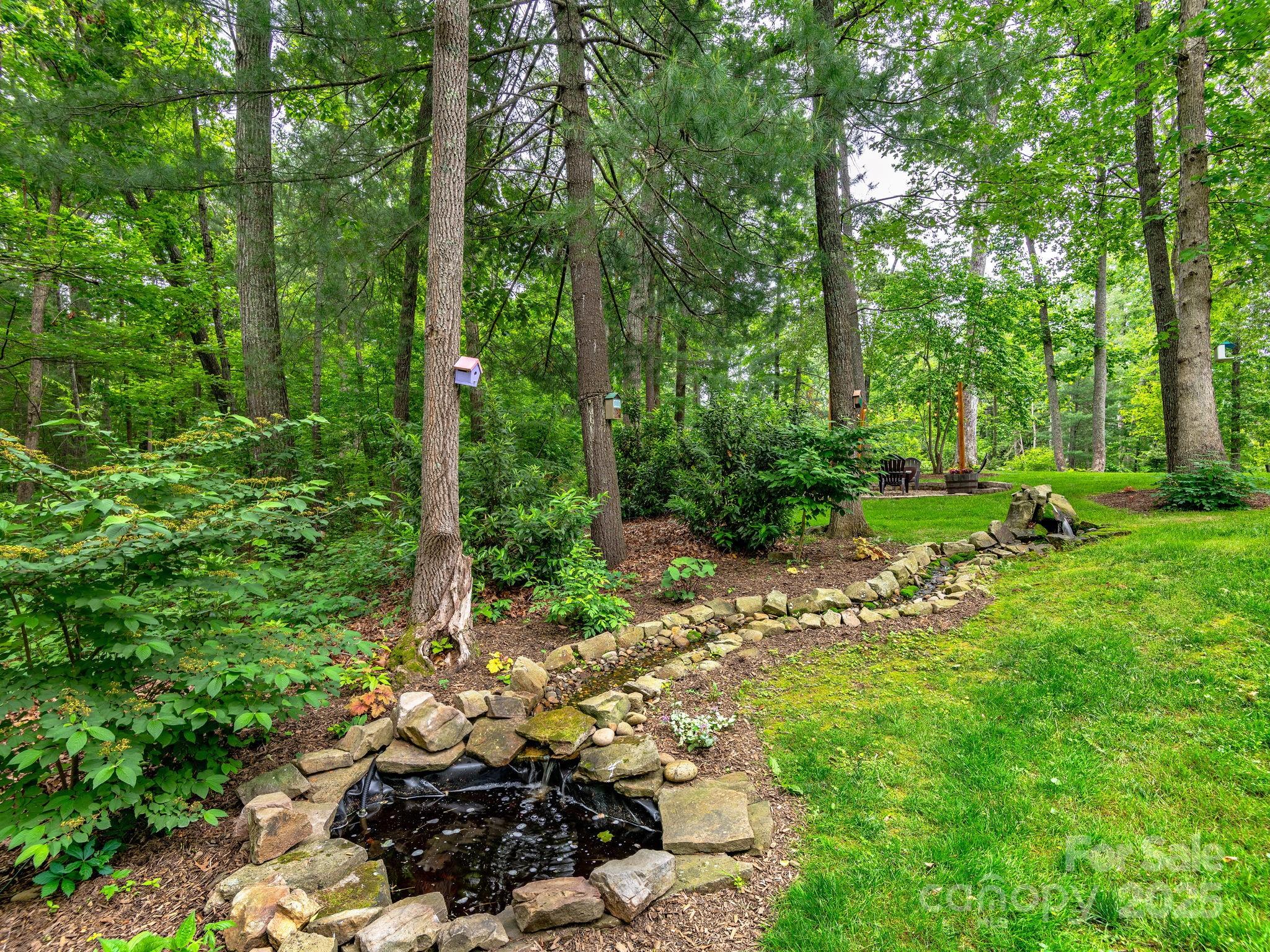 15 Avondale Road Asheville, NC 28803 - Photo 38 of 48 a backyard of a house with lots of green space