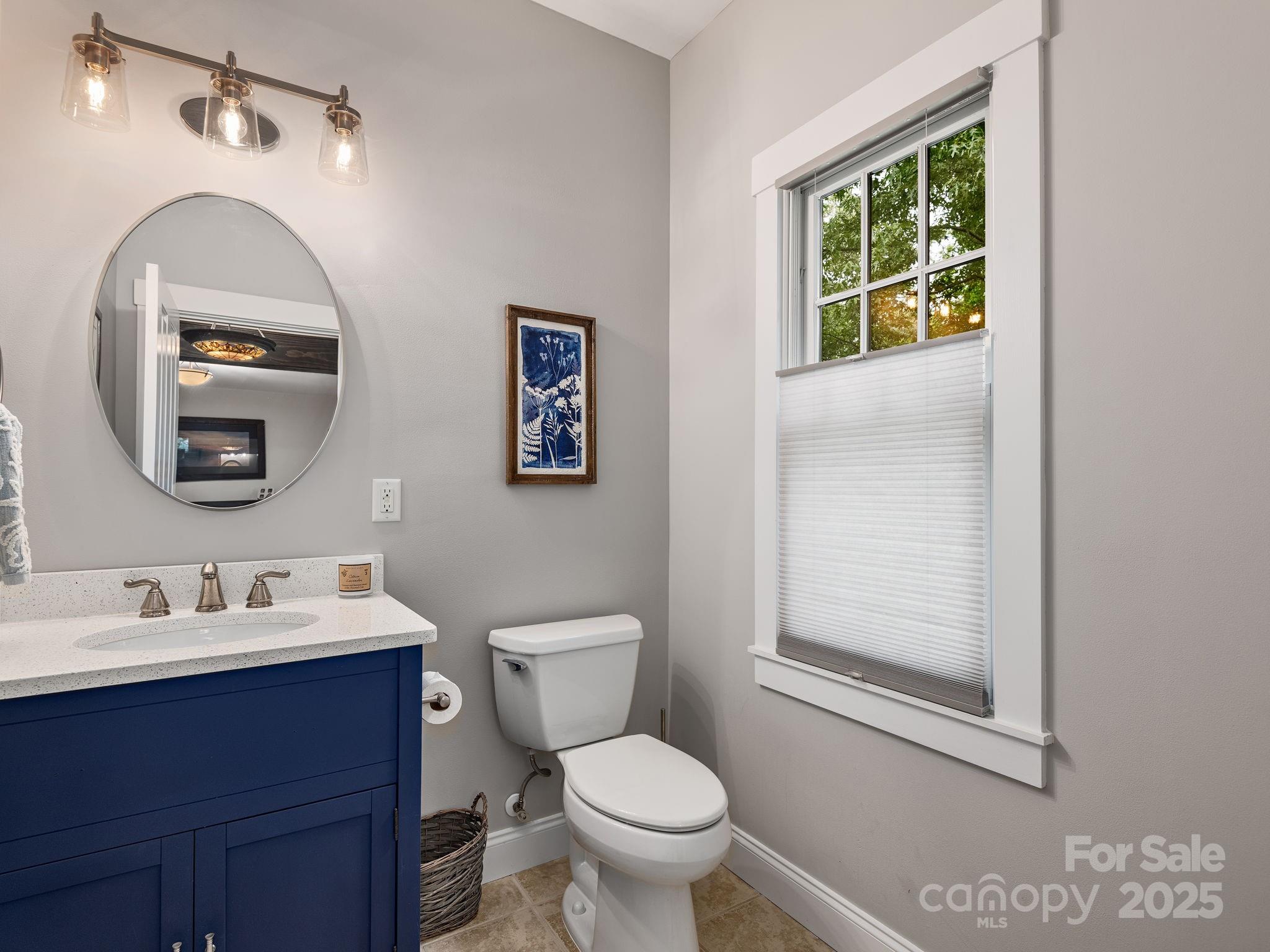 15 Avondale Road Asheville, NC 28803 - Photo 5 of 48 a bathroom with a toilet sink and mirror