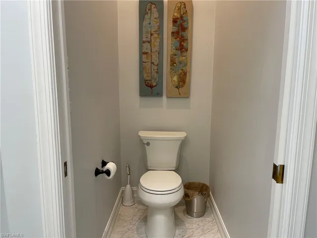 a bathroom with a toilet and a sink
