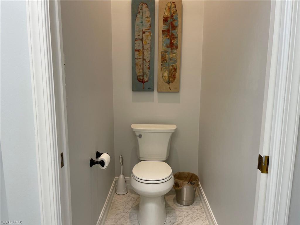 5950 Almaden Drive Naples, FL 34119 - Photo 12 of 22 a bathroom with a toilet and a sink