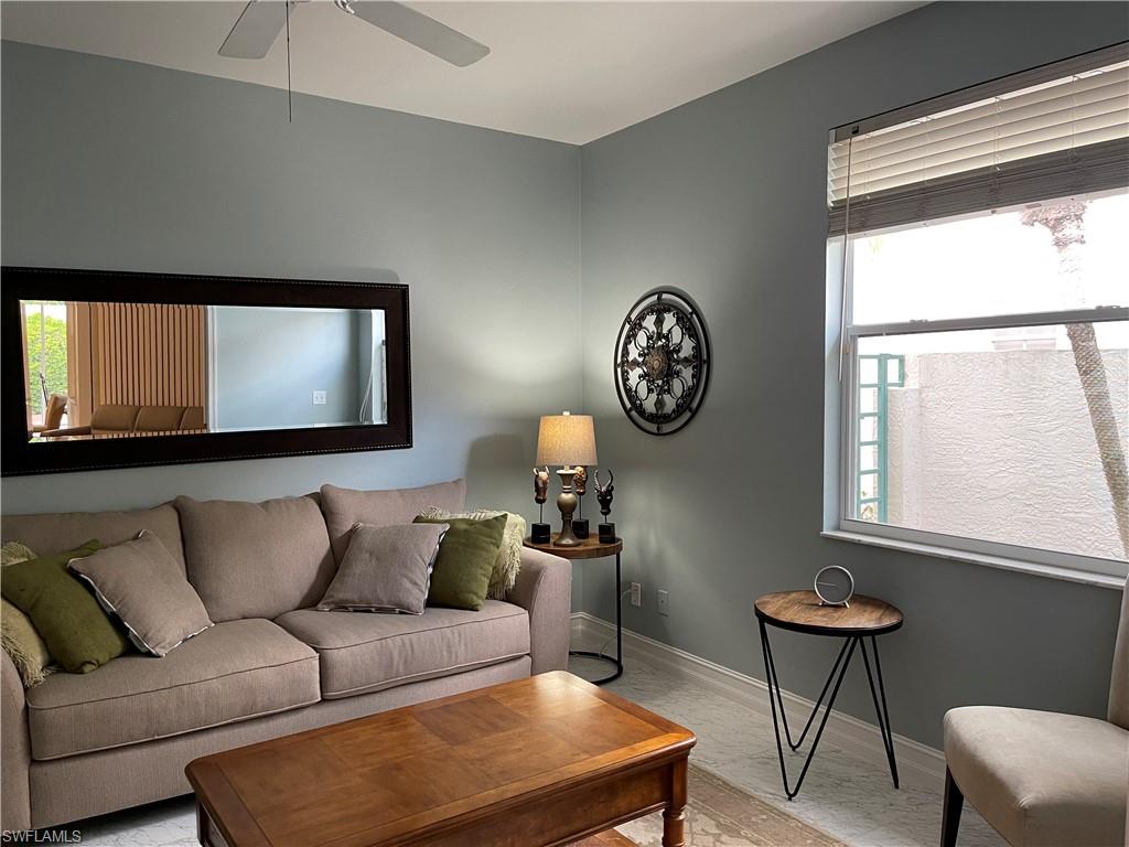 5950 Almaden Drive Naples, FL 34119 - Photo 17 of 22 a living room with furniture and a window