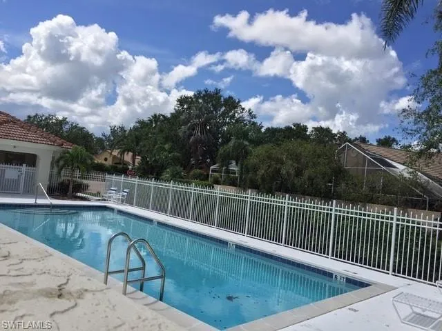 a view of a swimming pool with a roof deck