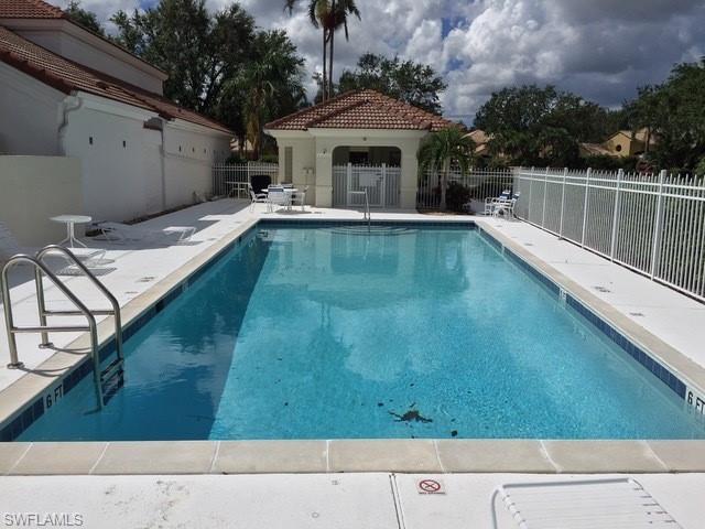5950 Almaden Drive Naples, FL 34119 - Photo 22 of 22 a view of a balcony with a floor to ceiling window