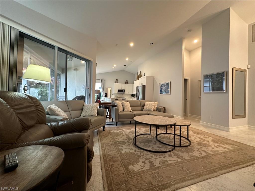 5950 Almaden Drive Naples, FL 34119 - Photo 7 of 22 a living room with furniture