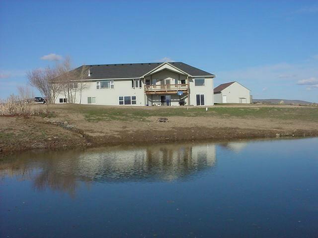 340 Black Hawk Road Yakima, WA 98908 - Photo 2 of 25 a front view of a house with a yard