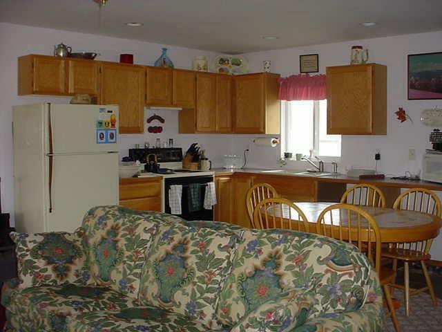 340 Black Hawk Road Yakima, WA 98908 - Photo 14 of 25 a kitchen with kitchen island granite countertop a sink stove and refrigerator