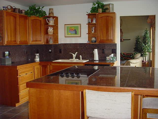 340 Black Hawk Road Yakima, WA 98908 - Photo 6 of 25 a kitchen with a sink and a refrigerator