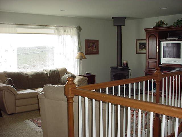 340 Black Hawk Road Yakima, WA 98908 - Photo 8 of 25 a living room with furniture fireplace and a window