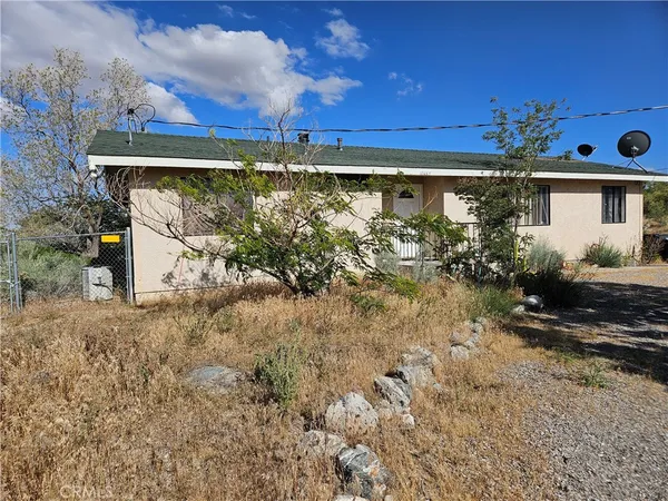 a view of a back yard of the house