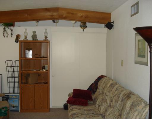 4949 Mable Street Corpus Christi, TX 78411 - Photo 5 of 9 a living room with a bed and furniture