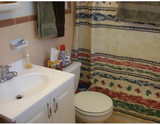 4949 Mable Street Corpus Christi, TX 78411 - Photo 7 of 9 a bathroom with a sink toilet and shower