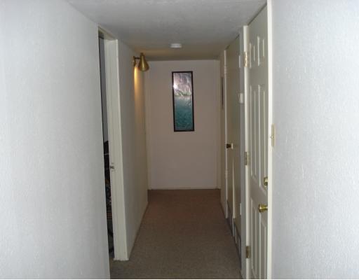 4949 Mable Street Corpus Christi, TX 78411 - Photo 8 of 9 a view of a hallway with wooden floor