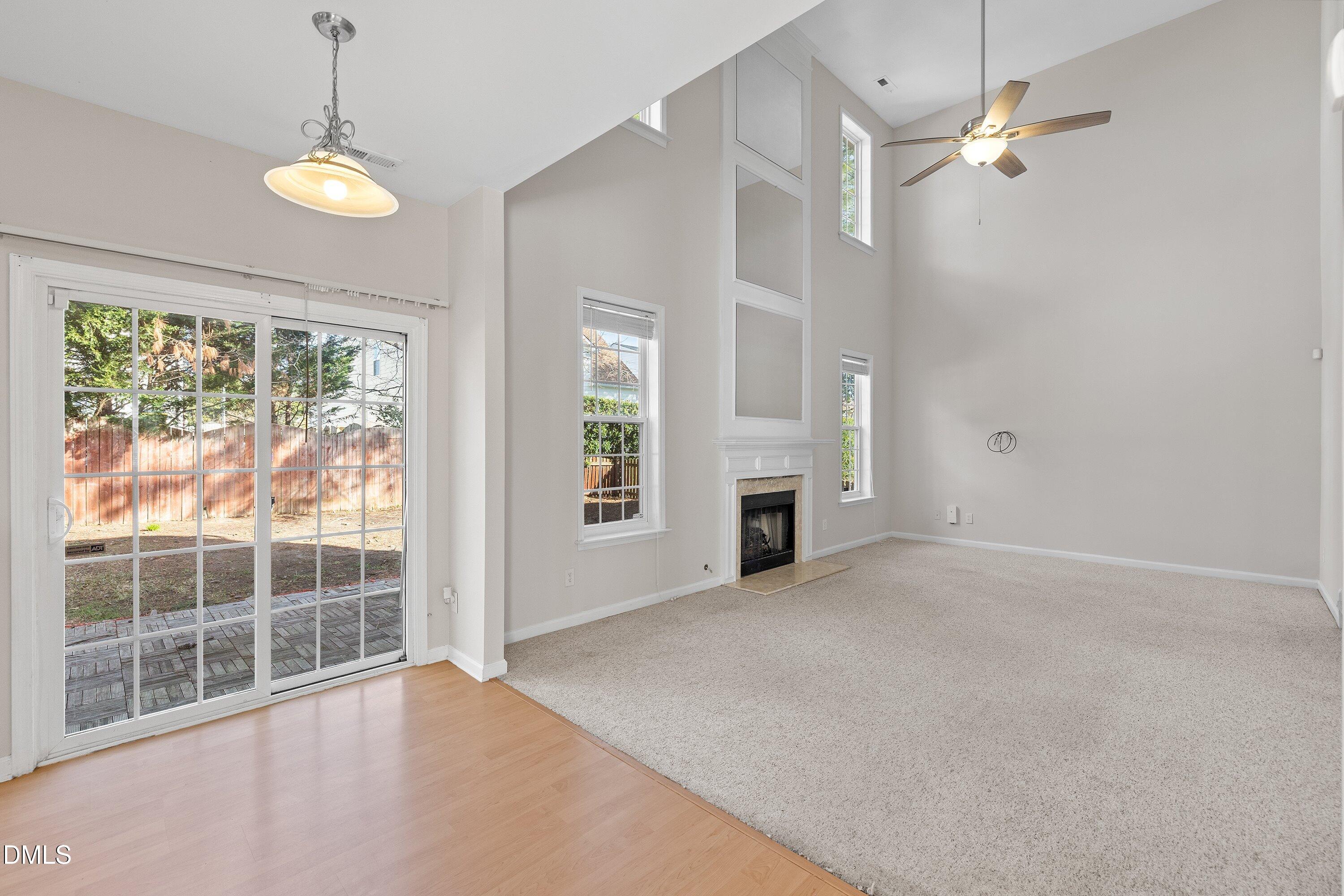 5717 Keowee Way Raleigh, NC 27616 - Photo 13 of 41 an empty room with windows and outdoor view