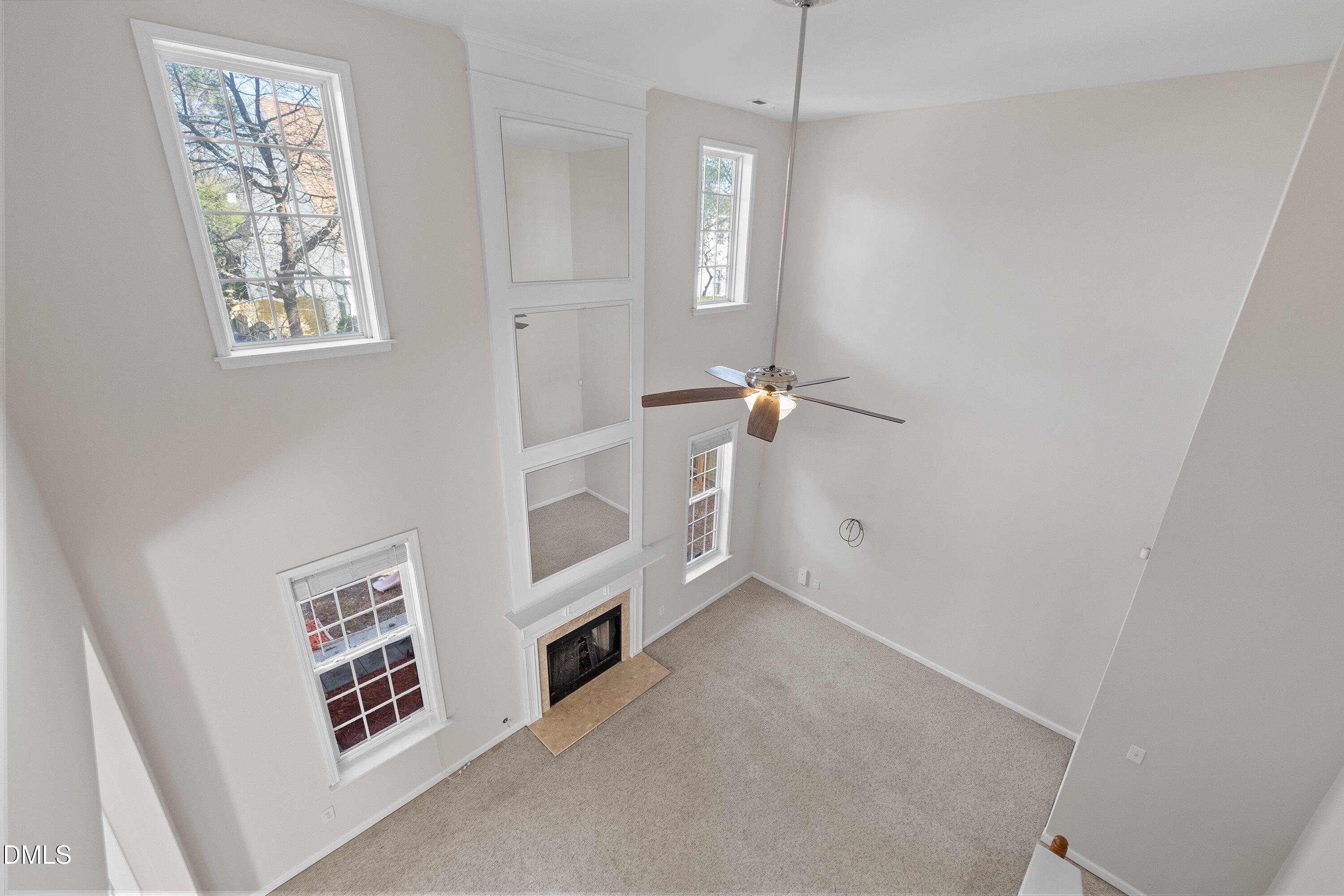 5717 Keowee Way Raleigh, NC 27616 - Photo 16 of 41 an empty room with windows