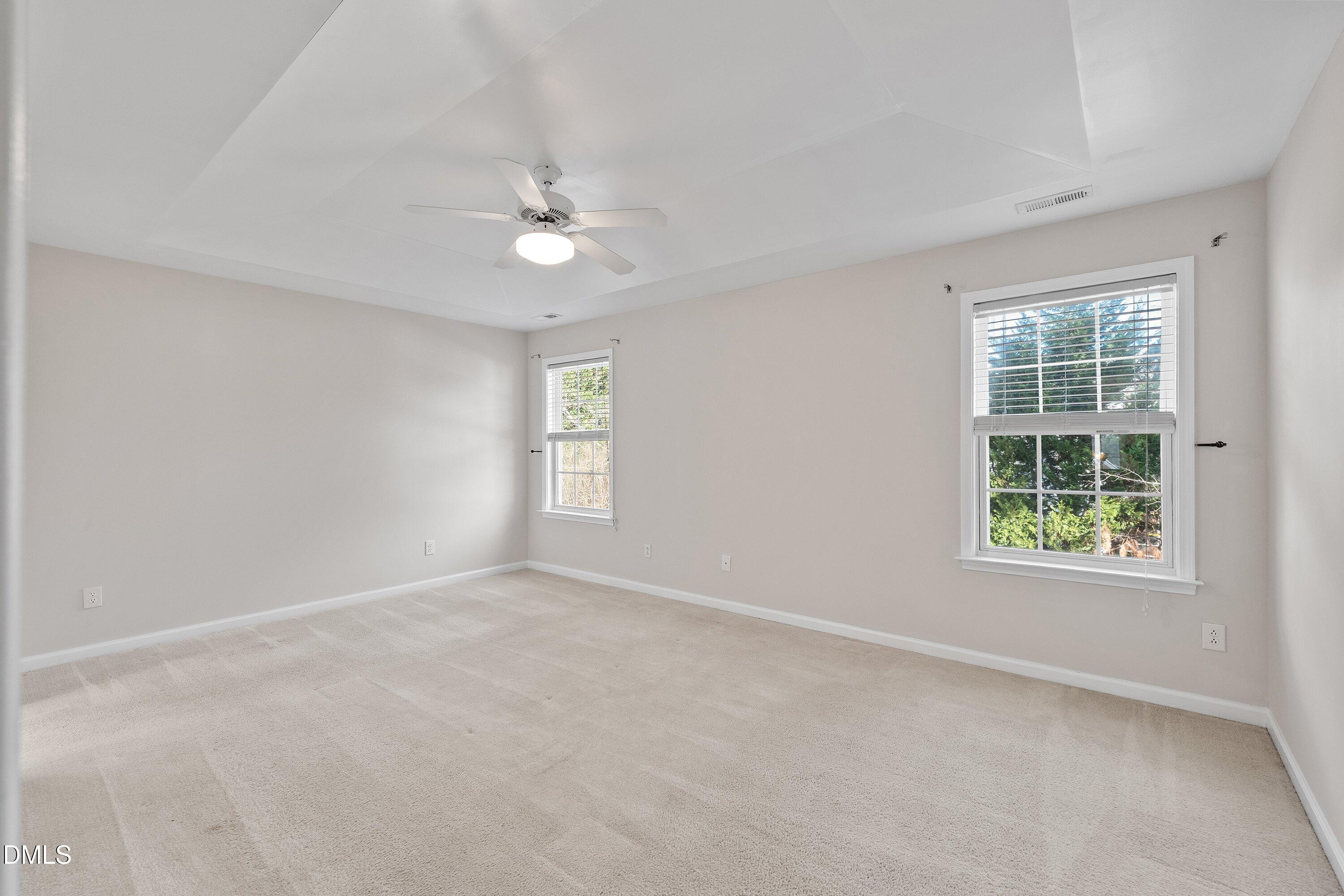 5717 Keowee Way Raleigh, NC 27616 - Photo 18 of 41 an empty room with windows and closet