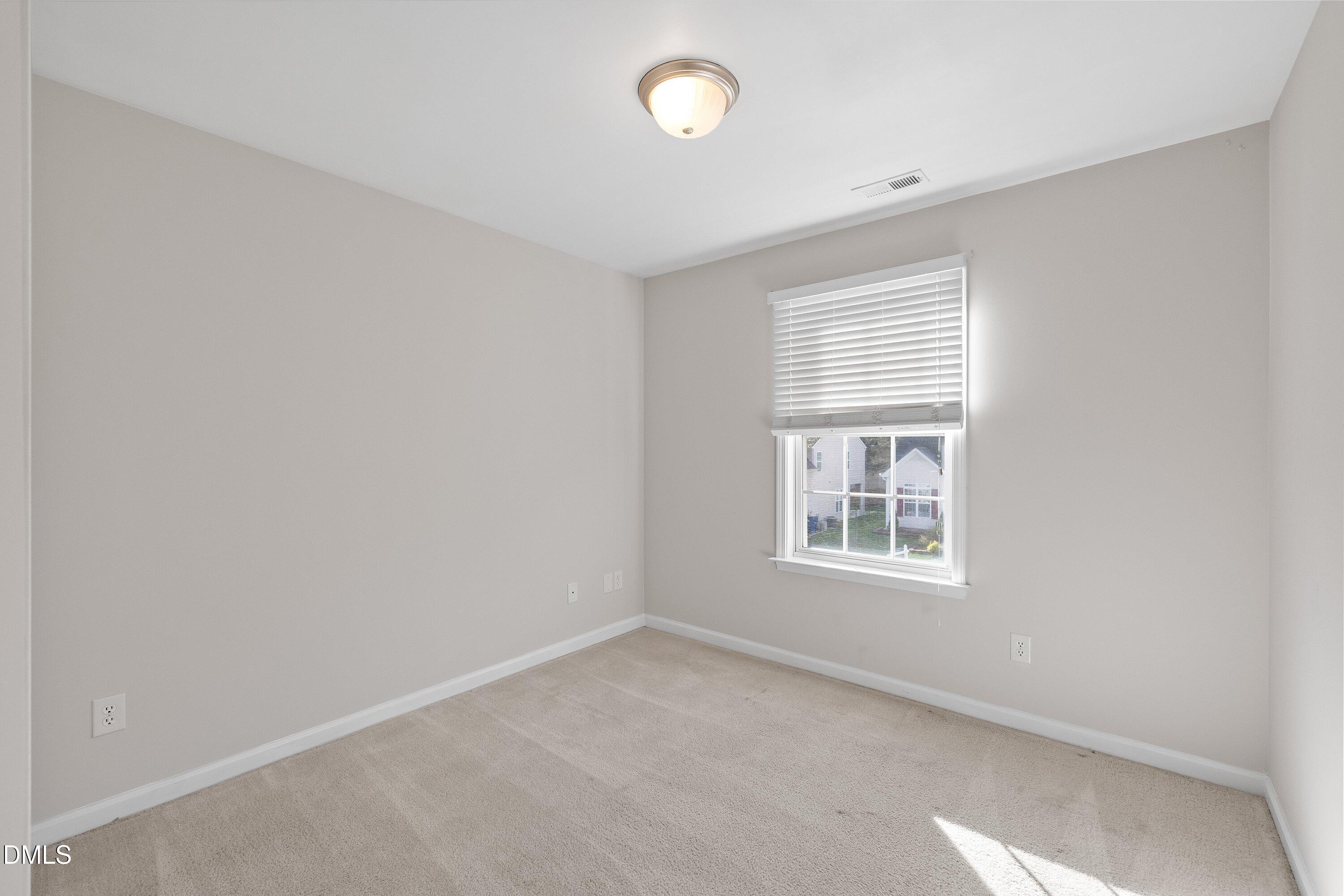 5717 Keowee Way Raleigh, NC 27616 - Photo 23 of 41 an empty room with a window