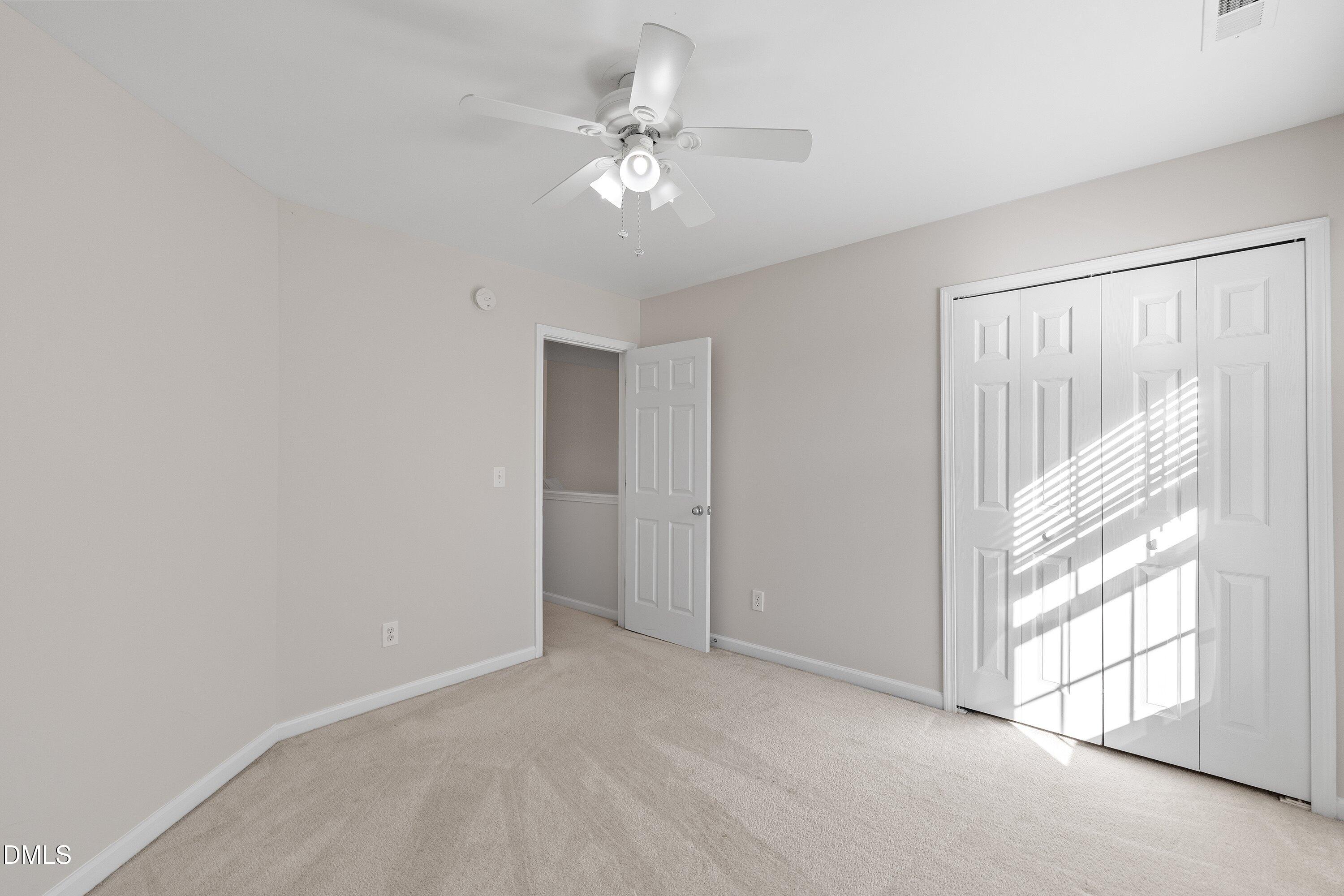 5717 Keowee Way Raleigh, NC 27616 - Photo 26 of 41 a view of a livingroom with a ceiling fan and window