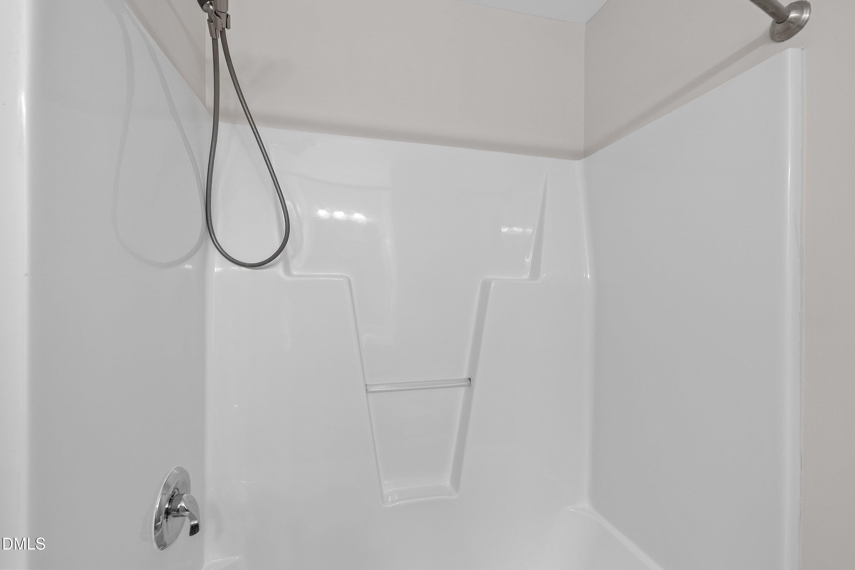 5717 Keowee Way Raleigh, NC 27616 - Photo 28 of 41 a bathroom with a shower